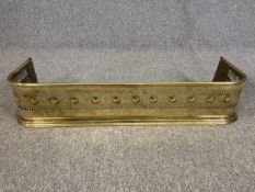 Fire kerb, 19th century pierced brass. H.16 W.80 D.26cm.