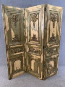 A heavy panelled three section screen or room divider with applied foliate decoration. H.209 W.