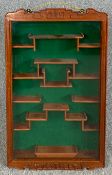 A Chinese carved hardwood wall mounted display cabinet. H.83 W.50cm