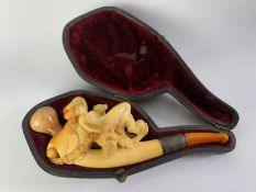 A cased 19th century Meerschaum pipe with Classical style carved figures and monogrammed white metal