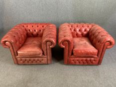 Chesterfield armchairs, a pair in deep buttoned and studded leather upholstery. H.74cm x W.105cm x