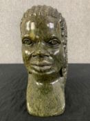 A carved green stone African bust. H.26cm