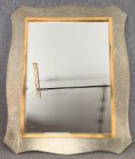 A contemporary silver and gilt framed wall mirror. H.127 W.96cm
