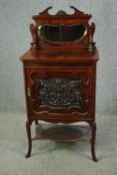 A late 19th century carved rosewood music cabinet. H.130 W.62 D.37cm.