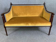A late 19th century canape sofa with carved mahogany frame. H.97cm x W.131cm x D.69cm