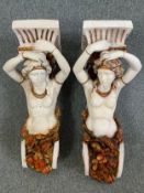 A pair of painted fibreglass wall sconce planters in the form of Classical Caryatids. H.75cm