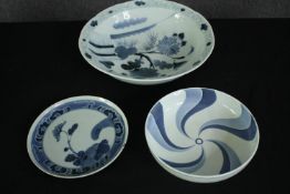 A collection of three 19th and early 20th century Japanese blue and white porcelain dishes. One with