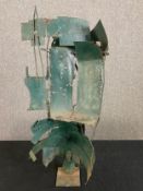 An abstract sheet metal sculpture. H.82 W.40 D.30cm.