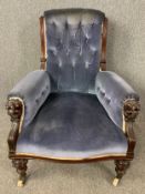 Armchair, Victorian carved walnut with lion mask arms in deep buttoned upholstery. H.94 W.72 D.96cm