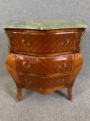 A Louis XV style kingwood and ormolu mounted bombe chest of drawers with marble top. H.82 W.82 D.