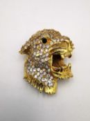A vintage Hattie Carnegie gold toned metal leopard head brooch inset with black and clear