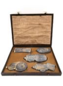 A Chinese calligraphy stone ink block set circa 1900, intricately carved in relief and hand