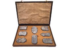 A Chinese calligraphy stone ink block set circa 1900, intricately carved in relief with gilt