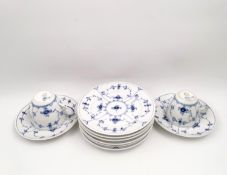 A part set of Royal Copenhagen blue fluted plain pattern porcelain to include two cups and saucers