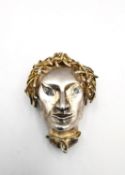 An Albion Craft Co. silver Medusa head brooch with sapphire eyes and gilt hair, with marks to the