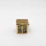 A 14k gold New York Times ‘All the News That’s Fit to Print’ charm composed of a miniature folded