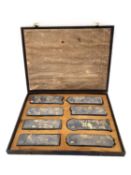 A Chinese calligraphy stone ink block set circa 1900, intricately carved in relief and hand