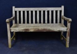 A vintage weathered teak garden bench. H.84 W.122 D.57cm