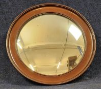 A 19th century style convex wall mirror in mahogany frame. H.33 W.33cm.