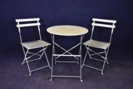 A painted metal folding garden table and a matching pair of chairs. H.70.5 Dia.60cm.