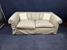 A contemporary two seater sofa bed. H.70 W.210 D.110cm