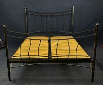A contemporary wrought metal double bedstead for a 5ft double mattress. H.135 W.155 D.220cm