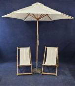 A large contemporary parasol on stand and two similar deckchairs. Parasol is H.250cm.