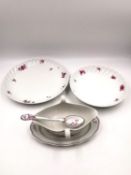 Three pieces of 19th century Meissen to include a gravy boat with spoon, and two scalloped plates