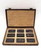 A Chinese calligraphy stone ink block set circa 1900, intricately carved in relief, hand painted and