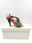 A papier-mâché hand made model shoe, decorated with a frog and dragon fly on a water-lily, in a wood