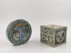 Two mid century Troika Cornwall pottery pieces, a wheel vase and cubic vase (chipped as seen). H.