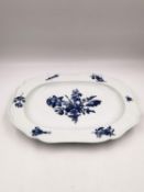 A 19th century blue and white Meissen platter with a central floral design with insects and sprigs