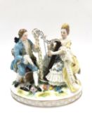 A Vienna porcelain hand painted and gilt figure group, an 18th century lady and gentleman playing