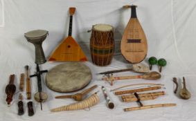 A miscellaneous collection of musical instruments to include mandolins, drums, pipes etc. H.90cm (