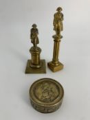 An early 19th century brass snuff box commemorating Admiral Lord Nelson along with two brass