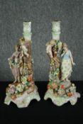 A pair of C G Schierholz & Sohn candlesticks with figural, cherub and flower encrusted stems, C.