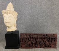 A plaster Buddha bust on base and an Eastern carved hardwood panel. H.74cm (largest)