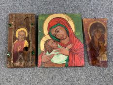 A collection of three religious icons painted on panel. H.37cm (largest)