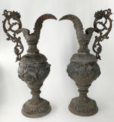 A pair of 19th century spelter ewers with scrolling fruit and sea life decoration. H.49cm (each)