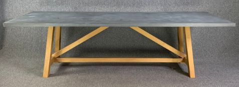 A contemporary zinc clad refectory style dining table on an oak trestle base. H.74 W.250 D.90cm