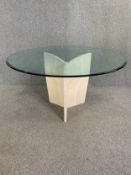 A vintage Italian Artelano dining table with plate glass top on travertine marble base. H.74 Dia.