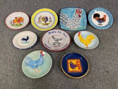 A collection of art pottery chicken decorated plates. Dia.29cm (largest)