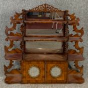 A 19th century kingwood, crossbanded and ormolu mounted wall cabinet with pierced and carved