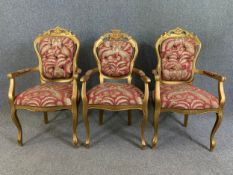 A pair of carved giltwood Louis XV style armchairs along with a similar single example. H.105 W.59