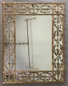 A large vintage gilt metal wall mirror in 19th century style with husk and ribbon decoration. H.