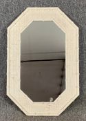 A white painted bamboo and rattan wall mirror. H.84 W.56cm