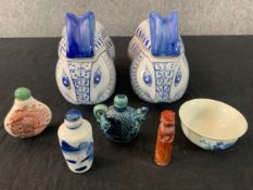 A miscellaneous collection of Chinese porcelain boxes and snuff bottles along with a soapstone seal.