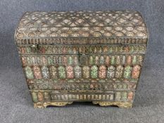 A North African bone domed top coffer, metal clad and mounted and inset with semi precious stones.