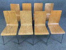 A set of eight retro styled laminated plywood dining chairs on chrome supports. H.87 W.40 D.45cm (
