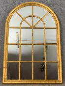 A giltwood framed window pane wall or overmantel mirror. H.152 W.101cm